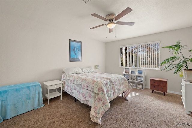 bedroom featuring a ceiling fan, carpet flooring, and baseboards