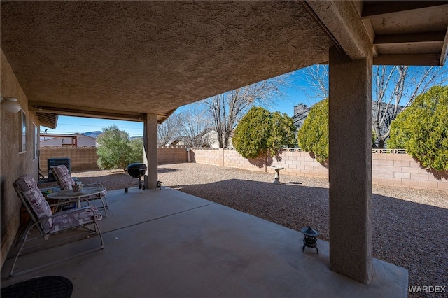 view of patio with a fenced backyard