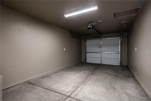 garage featuring baseboards and a garage door opener