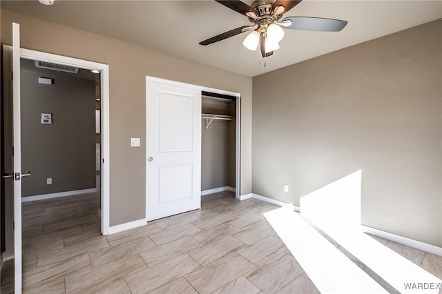 unfurnished bedroom with a ceiling fan, baseboards, visible vents, and a closet