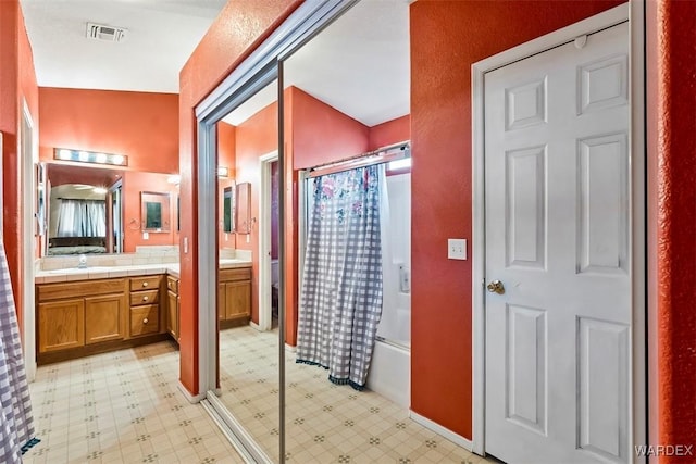 bathroom with vanity, tile patterned floors, toilet, and visible vents