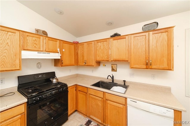 kitchen with under cabinet range hood, a sink, lofted ceiling, black range with gas stovetop, and dishwasher