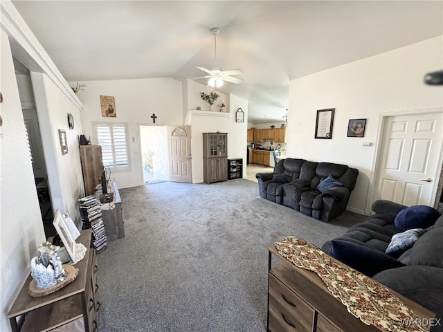 living area featuring lofted ceiling, a ceiling fan, baseboards, and light carpet