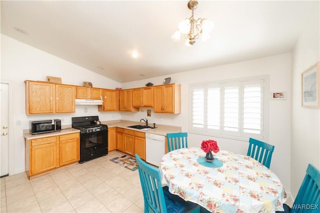 kitchen with stainless steel microwave, under cabinet range hood, dishwasher, light countertops, and black range with gas cooktop