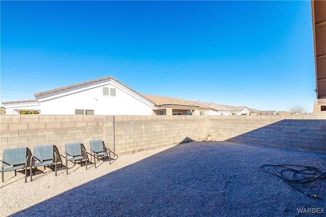 view of yard with a patio area and a fenced backyard