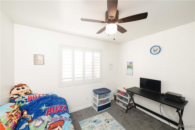 carpeted bedroom with ceiling fan and baseboards