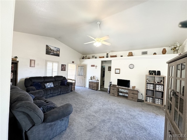 carpeted living room with vaulted ceiling, visible vents, and ceiling fan