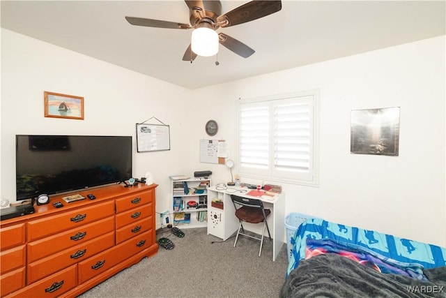 bedroom featuring a ceiling fan and carpet