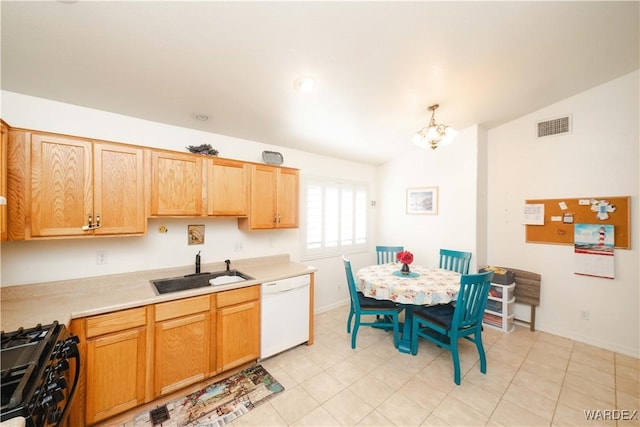 kitchen with visible vents, black gas stove, a sink, light countertops, and dishwasher