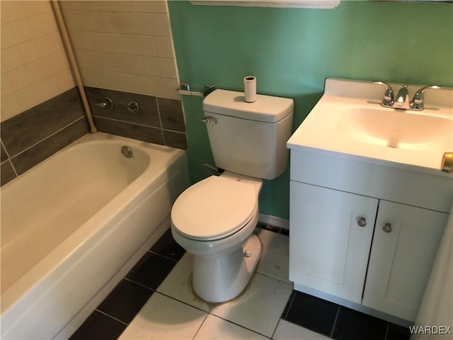 bathroom featuring tub / shower combination, vanity, toilet, and tile patterned floors