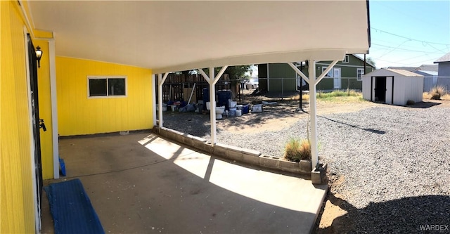 view of patio with a fenced backyard, an outdoor structure, and a shed