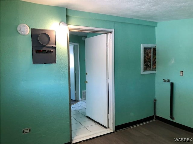 interior space with light wood-style floors and visible vents