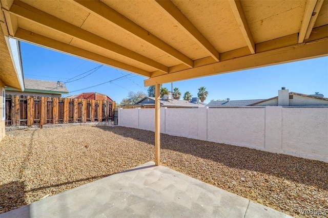 view of yard featuring a patio area and a fenced backyard