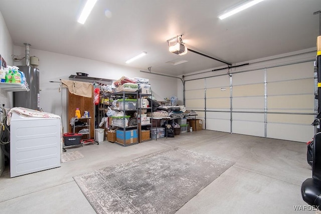 garage with gas water heater and a garage door opener