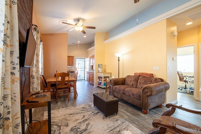 living room with visible vents, a ceiling fan, wood finished floors, and recessed lighting