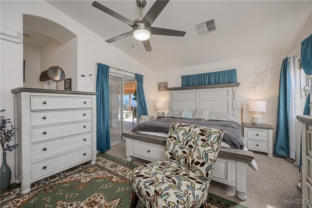 bedroom with visible vents, dark carpet, vaulted ceiling, ceiling fan, and access to outside