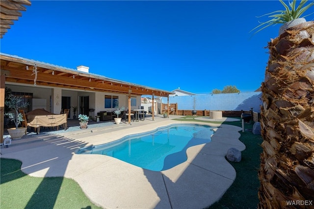 view of swimming pool featuring a patio area, a fenced backyard, and a fenced in pool