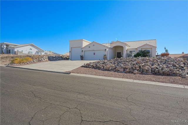 view of front of home with driveway and an attached garage