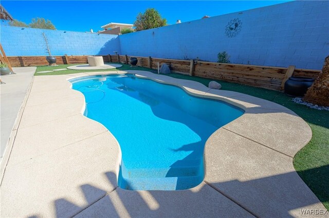 view of swimming pool with a patio, a fenced backyard, and a fenced in pool