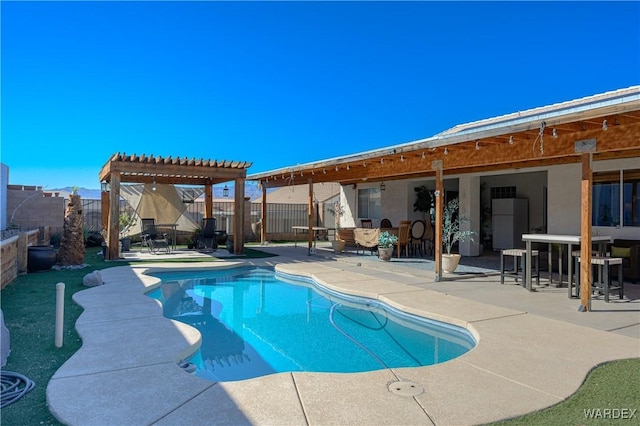 view of swimming pool with a patio area, a fenced backyard, a fenced in pool, and a pergola