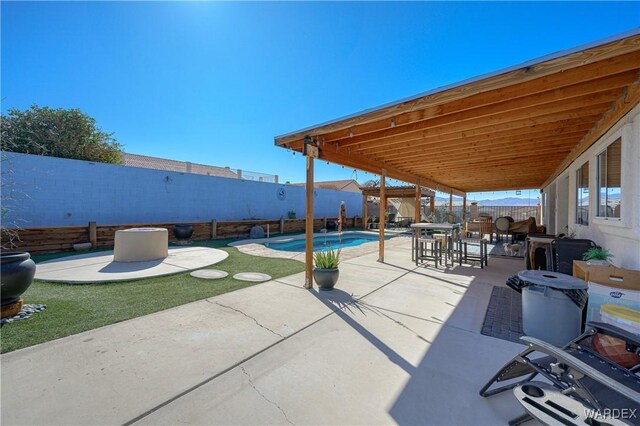 view of patio / terrace with a fenced backyard and a fenced in pool