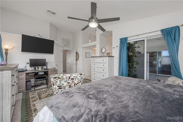 bedroom featuring access to outside, visible vents, and a ceiling fan