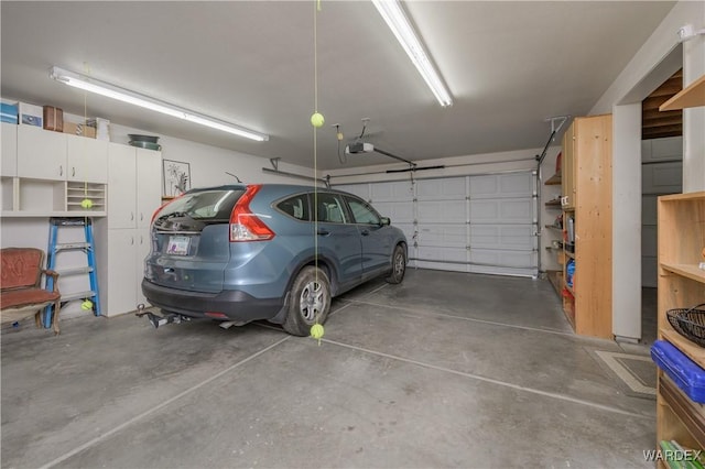 garage featuring a garage door opener