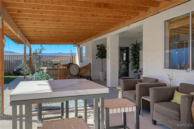 view of patio / terrace featuring outdoor dining space and fence