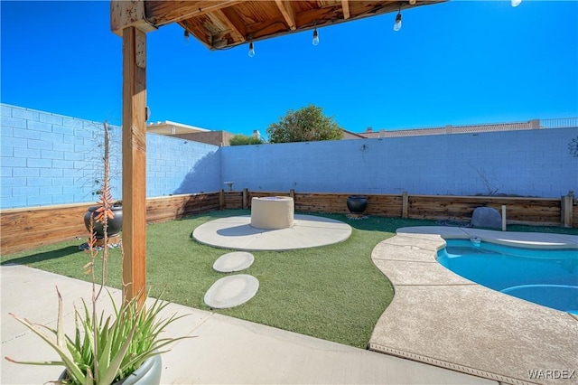 view of swimming pool with a patio, a fenced backyard, and a fenced in pool