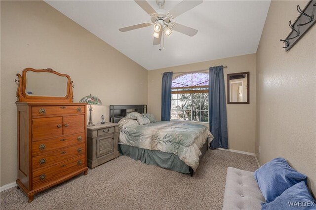 carpeted bedroom featuring baseboards, vaulted ceiling, and a ceiling fan