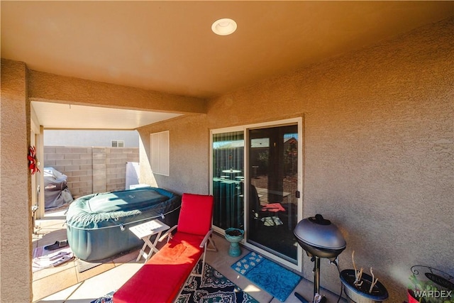 view of patio featuring fence and area for grilling