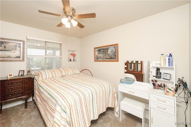 bedroom featuring a ceiling fan and light colored carpet