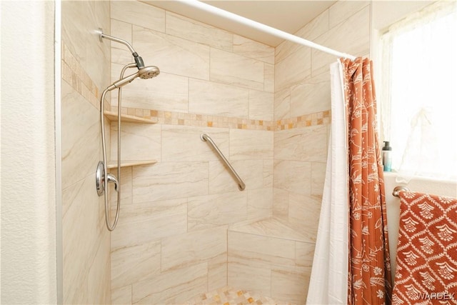 bathroom featuring a shower stall