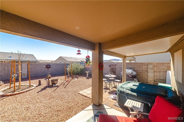 view of patio / terrace featuring a fenced backyard and a grill