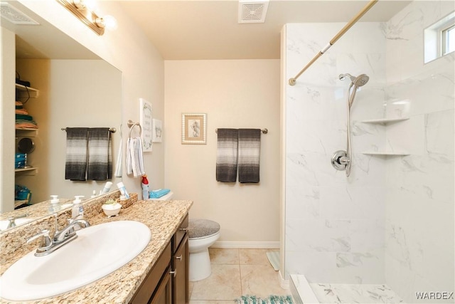 full bath featuring toilet, vanity, walk in shower, and visible vents