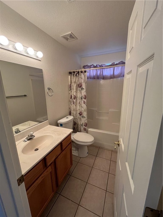 full bath featuring a textured ceiling, vanity, toilet, tile patterned floors, and shower / bathtub combination with curtain