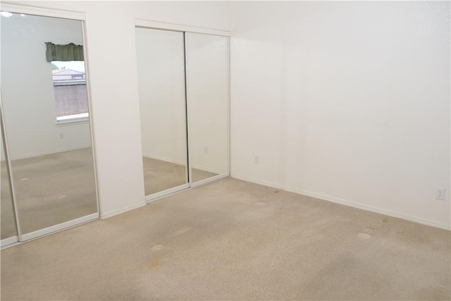 unfurnished bedroom with carpet
