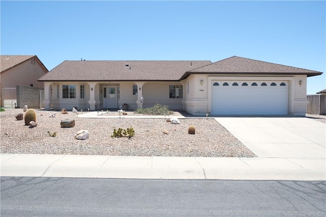 single story home featuring stucco siding, an attached garage, driveway, and roof with shingles