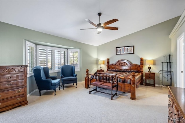 bedroom with lofted ceiling, carpet, and baseboards