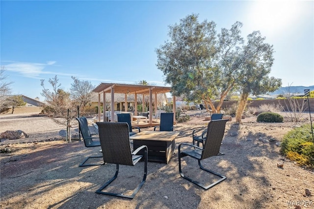 view of patio featuring fence and a pergola