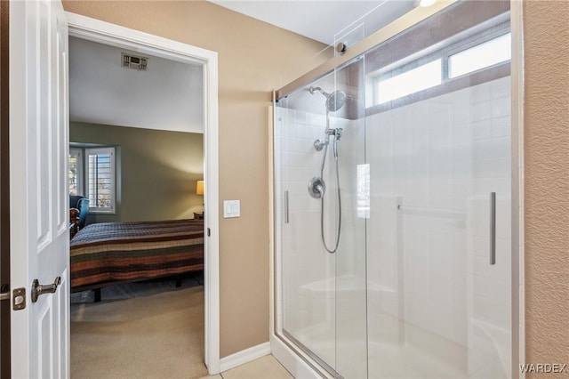 bathroom with a stall shower, visible vents, and ensuite bath