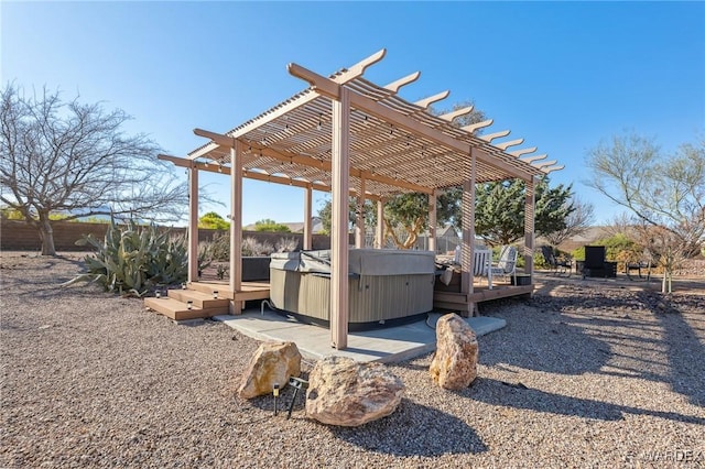 view of yard with a hot tub, fence, a pergola, and a wooden deck