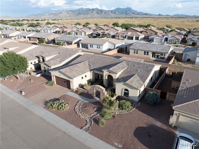 bird's eye view with a residential view and a mountain view