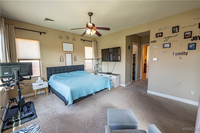 carpeted bedroom with baseboards, multiple windows, and visible vents