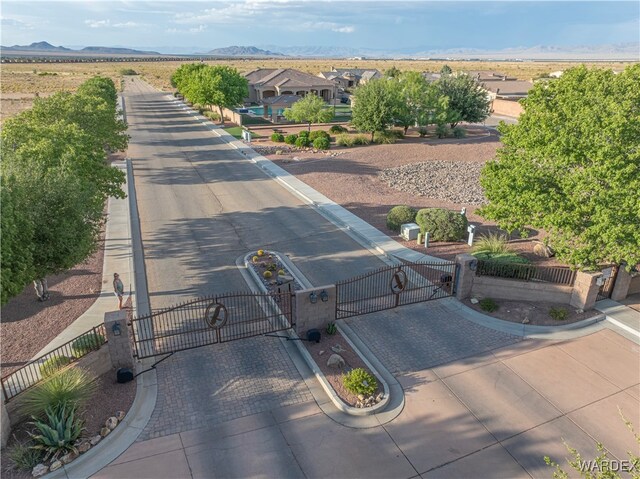 birds eye view of property with a mountain view