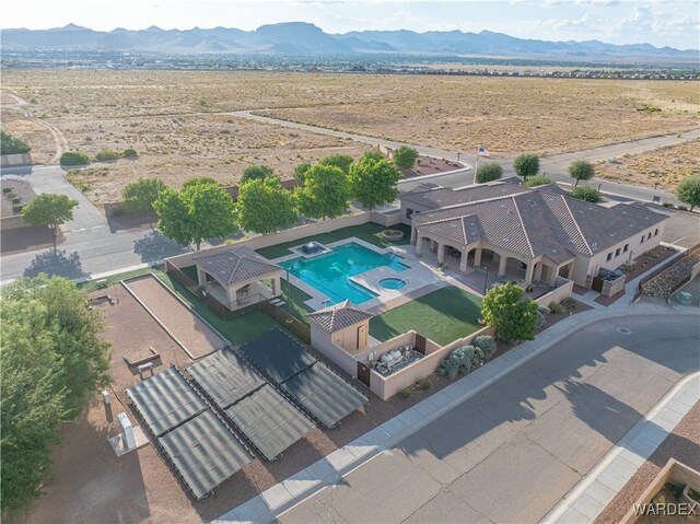 birds eye view of property featuring a mountain view