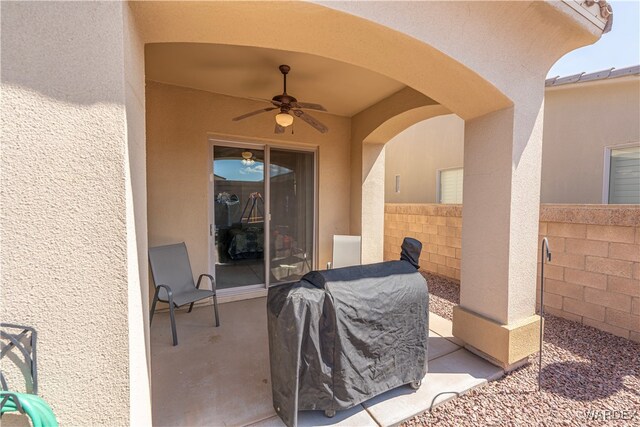 view of patio / terrace with ceiling fan, fence, and area for grilling