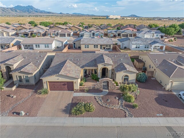 birds eye view of property with a residential view and a mountain view