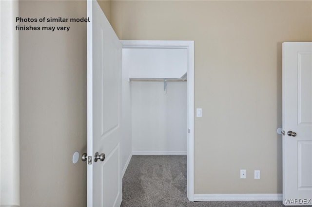 interior space with a closet, carpet, and baseboards