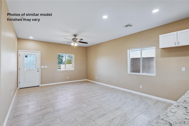 unfurnished living room with visible vents, ceiling fan, recessed lighting, and baseboards